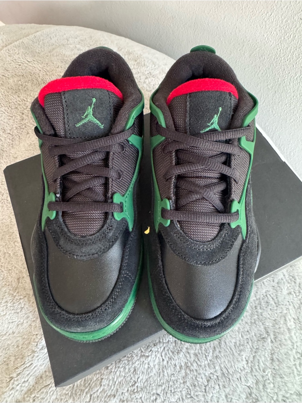 Jordan Kids Black Sneakers with Green Accents and Red Trim
